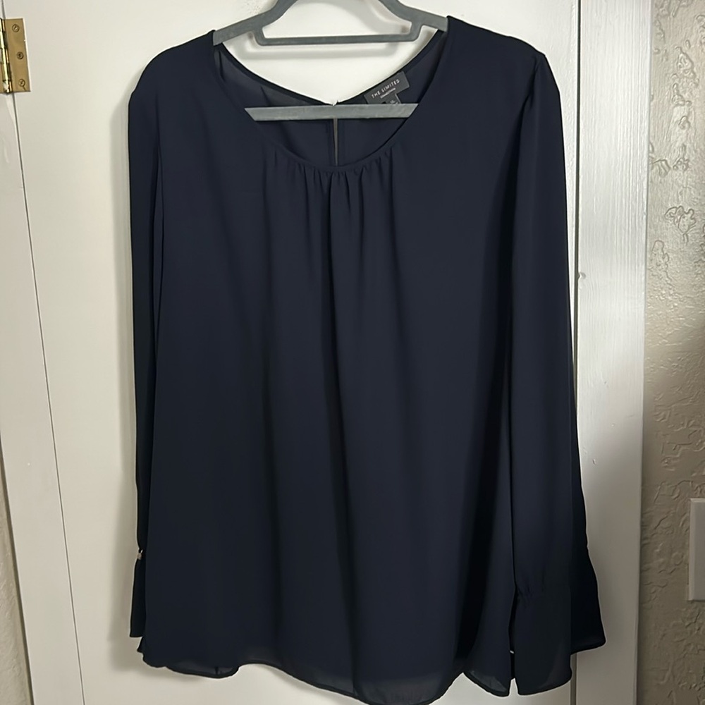 The limited navy blouse with buttoned sleeve